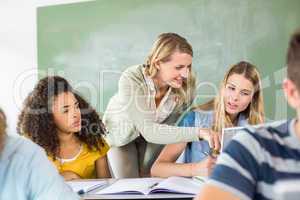 Teacher helping student in class