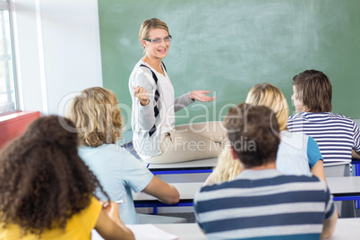 Teacher teaching students in class