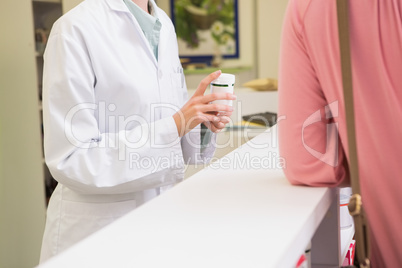 Pharmacist and her customer talking about medication