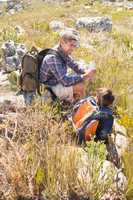 Father and son hiking in the mountains