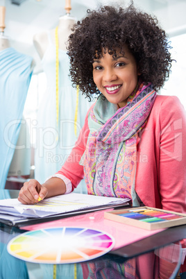 Attractive female fashion designer at work