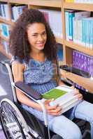 Smiling disabled student in library