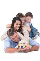 Happy family with puppy