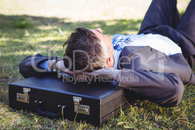 Businessman relaxing in the park