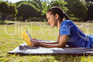 Pretty woman reading in the park