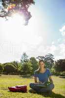 Pretty student studying outside