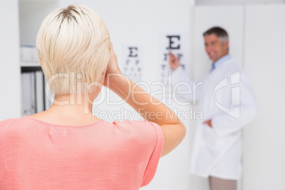 Blonde woman doing eye exam