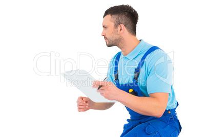 Handyman reading clipboard