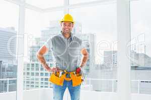 Smiling handyman standing in building