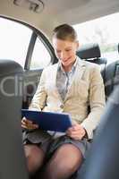 Businesswoman working on her tablet computer