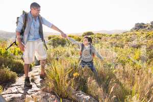 Father and son hiking through mountains