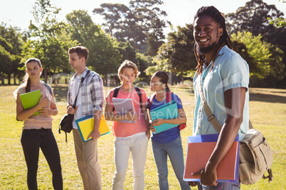 Happy students outside on campus