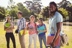 Happy students outside on campus