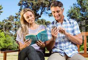 Couple relaxing in the park on bench