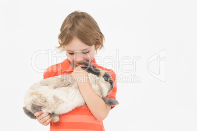 Cute boy holding bunny