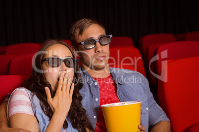 Young couple watching a 3d film