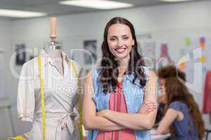 Confident female fashion designer with arms crossed