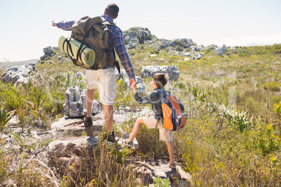 Father and son hiking in the mountains