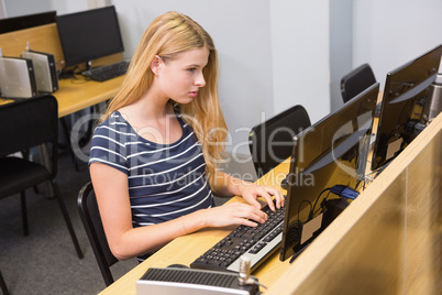 Student working on computer in classroom