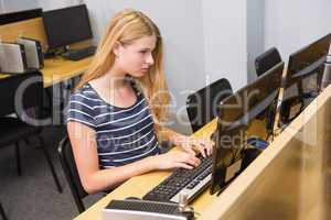 Student working on computer in classroom