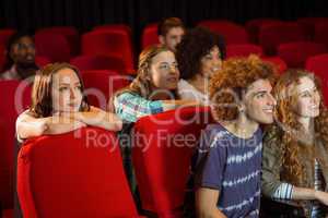 Young friends watching a film