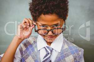 Cute little boy holding glasses