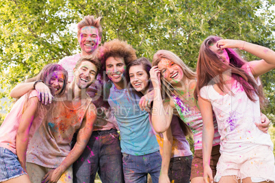 Happy friends covered in powder paint