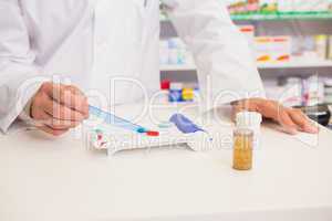 Pharmacist preparing some medicine