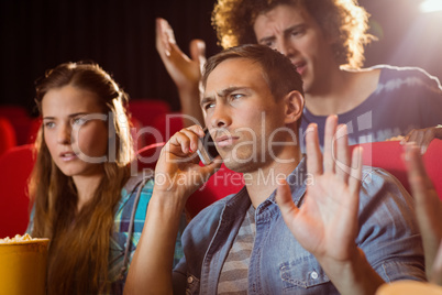 Annoying man on the phone during movie