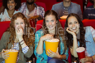 Young friends watching a film