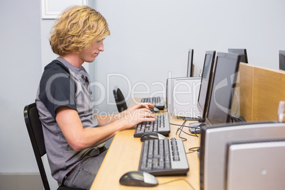 Student working on computer in classroom