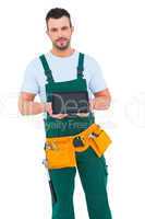 Construction worker holding tablet pc
