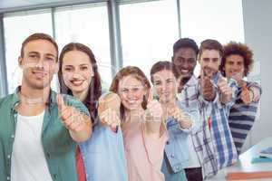 Fashion students showing thumbs up