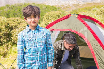 Father and son in their tent