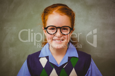 Portrait of cute little girl smiling in classroom