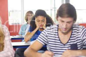 Thoughtful female student in classroom