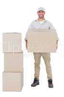 Courier man carrying cardboard box