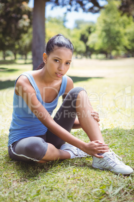 Fit woman with injured ankle Fit woman with injured ankle
