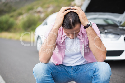 Stressed man after a car breakdown