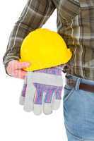 Manual worker holding helmet and gloves