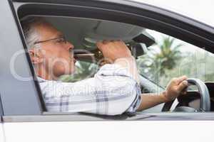 Man drinking beer while driving