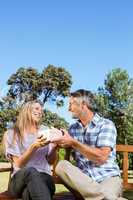 Couple relaxing in the park on bench