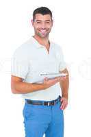 Smiling handyman with clipboard on white background