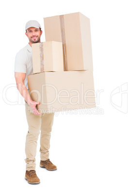 Delivery man carrying cardboard boxes