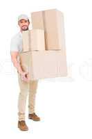 Delivery man carrying cardboard boxes