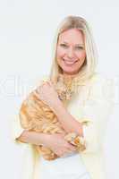 Portrait of beautiful woman holding cat