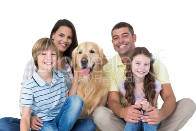 Happy family with golden retriever