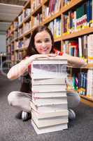 Student sitting on floor in library