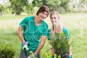 Happy friends gardening for the community