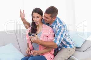 Man gifting ring to surprised woman
